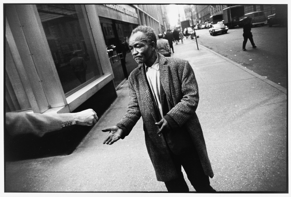 Winogrand, Street Beggar Reaching out to Receive a Donation, 1968